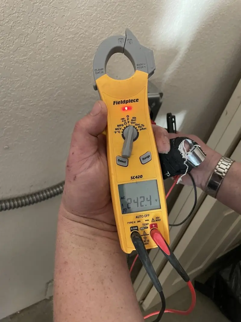 Voltage testing with clamp meter during Recessed Lighting Installation in Kings Park